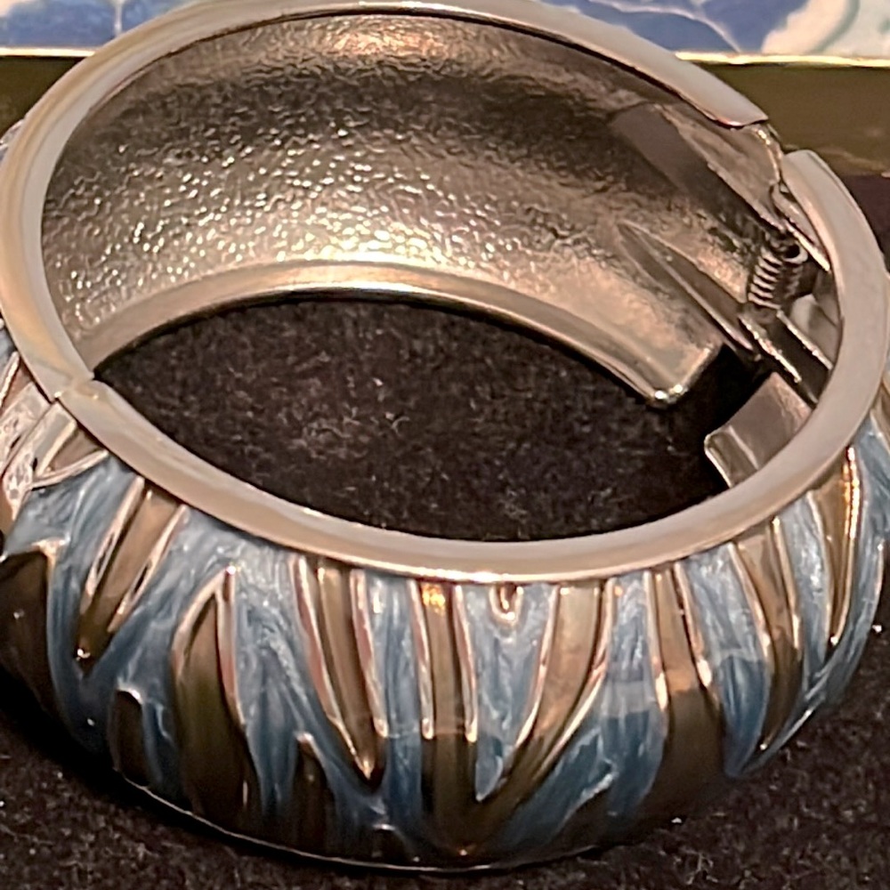 Gold and blue swirly design bracelet.